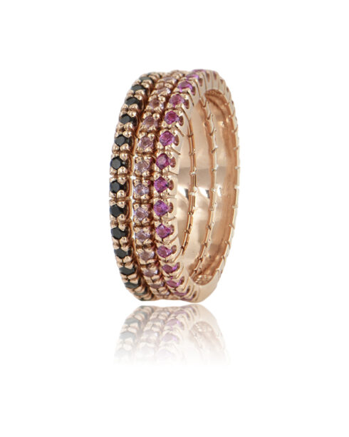 14K gold rings arranged together on neutral surface