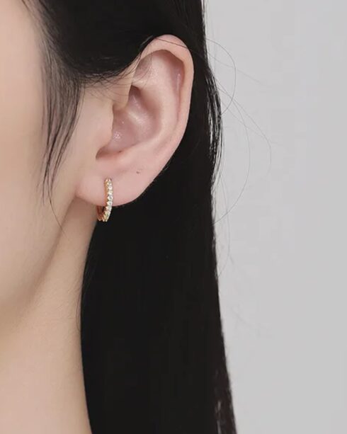 Gold pavé huggie earrings with round white zirconias, 18K gold plated, by Maxdilon Jewellery